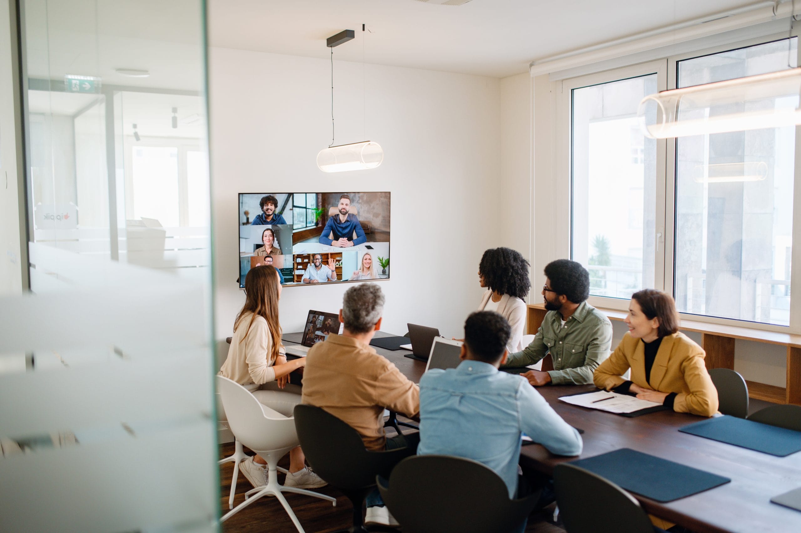 A hybrid team in a meeting or training